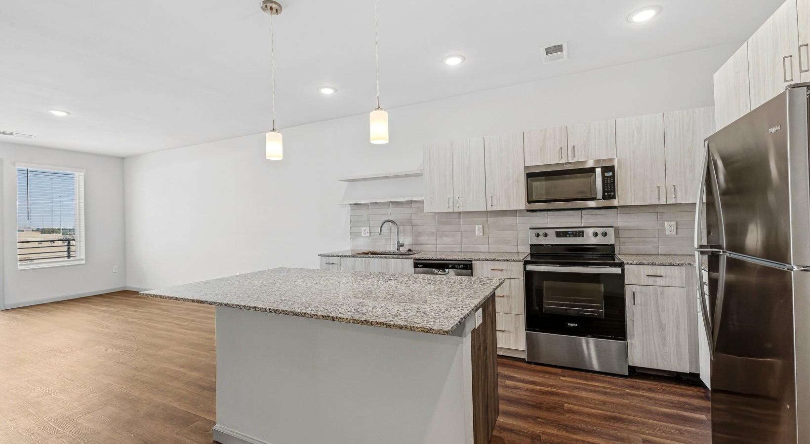 a kitchen with white cabinets